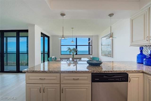9375 Gulf Shore Dr Unit 402, Naples, FL 34108 - kitchen with dishwasher, light stone counters, and pendant lighting