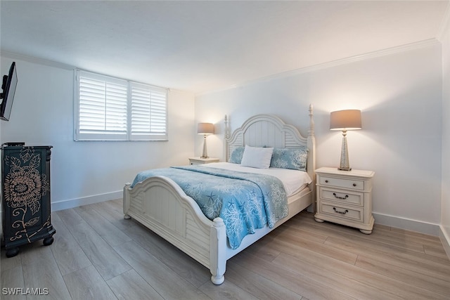 9375 Gulf Shore Dr Unit 402, Naples, FL 34108 - bedroom with light wood-style floors and crown molding