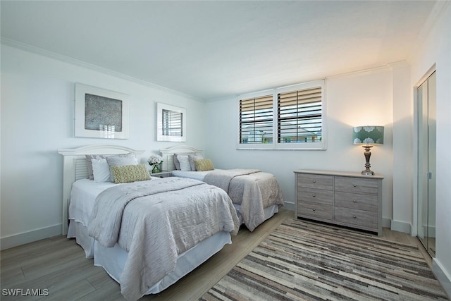 9375 Gulf Shore Dr Unit 402, Naples, FL 34108 - bedroom with wood finished floors and ornamental molding