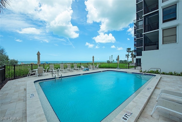 9375 Gulf Shore Dr Unit 402, Naples, FL 34108 - community pool with a patio area and a water view