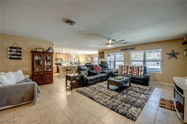 1817 SW 3rd Ave, Cape Coral, FL 33991 - living room with ceiling fan, light tile patterned flooring, and a chandelier