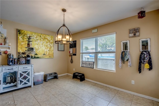 1817 SW 3rd Ave, Cape Coral, FL 33991 - dining space featuring a chandelier and light tile patterned flooring