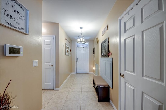 1817 SW 3rd Ave, Cape Coral, FL 33991 - foyer entrance with light tile patterned floors and a chandelier