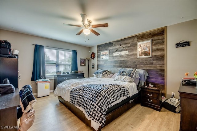 1817 SW 3rd Ave, Cape Coral, FL 33991 - bedroom with an accent wall, light wood-style floors, and a ceiling fan