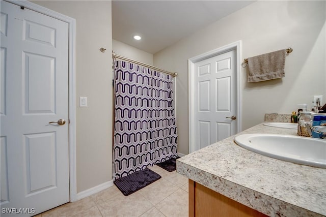 1817 SW 3rd Ave, Cape Coral, FL 33991 - full bathroom featuring double vanity, tile patterned flooring, and curtained shower