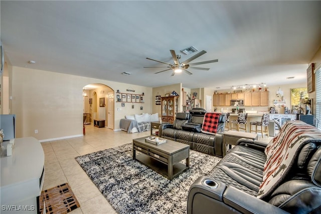 1817 SW 3rd Ave, Cape Coral, FL 33991 - living area featuring ceiling fan, arched walkways, and light tile patterned floors