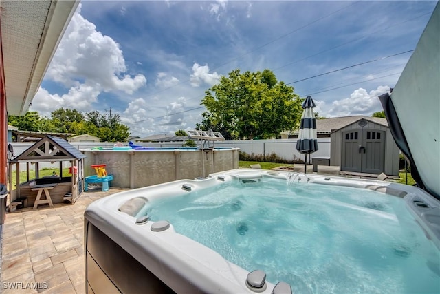 1817 SW 3rd Ave, Cape Coral, FL 33991 - view of pool with a hot tub, a storage shed, a swimming pool, and a patio area