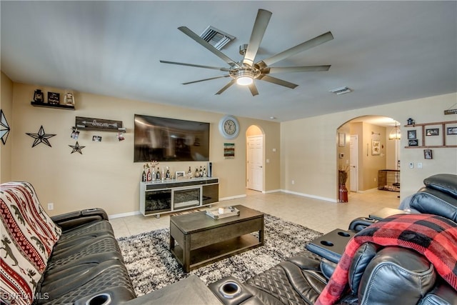 1817 SW 3rd Ave, Cape Coral, FL 33991 - living room featuring arched walkways, a ceiling fan, and tile patterned floors