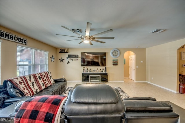 1817 SW 3rd Ave, Cape Coral, FL 33991 - tiled living room with arched walkways and a ceiling fan
