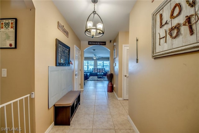 1817 SW 3rd Ave, Cape Coral, FL 33991 - hallway featuring a chandelier, light tile patterned floors, and arched walkways