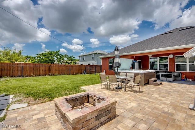 1817 SW 3rd Ave, Cape Coral, FL 33991 - fenced backyard featuring a hot tub, a fire pit, a patio area, and outdoor dining area