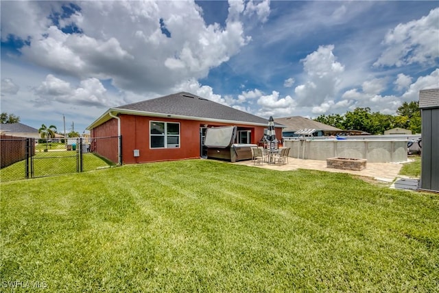 1817 SW 3rd Ave, Cape Coral, FL 33991 - rear view of property with a gate, an outdoor fire pit, a patio area, a shingled roof, and stucco siding