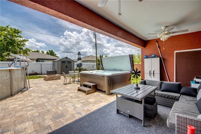1817 SW 3rd Ave, Cape Coral, FL 33991 - fenced backyard with a hot tub, a ceiling fan, a patio area, a storage unit, and outdoor lounge area