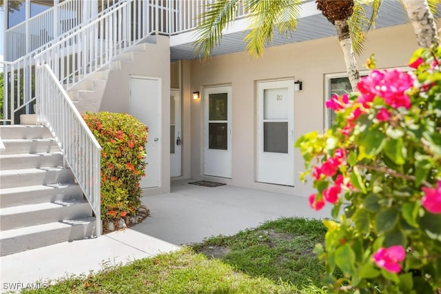 601 Periwinkle Way Unit D1, Sanibel, FL 33957 - view of exterior entry with stucco siding