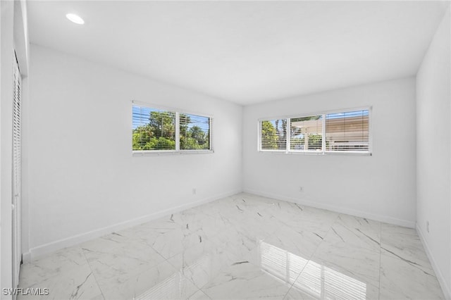 601 Periwinkle Way Unit D1, Sanibel, FL 33957 - spare room featuring marble finish floors and recessed lighting