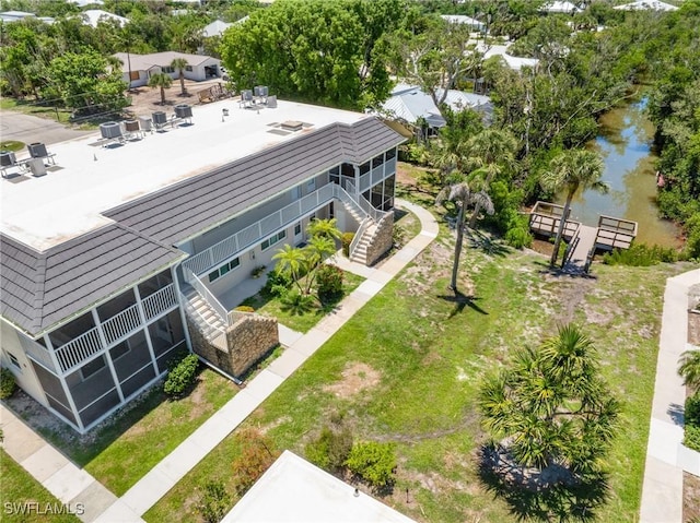 601 Periwinkle Way Unit D1, Sanibel, FL 33957 - view of subject property featuring a nearby body of water and a tree filled landscape