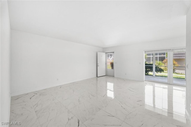 601 Periwinkle Way Unit D1, Sanibel, FL 33957 - empty room with light marble finish floors and baseboards