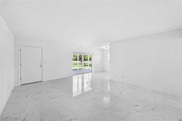 601 Periwinkle Way Unit D1, Sanibel, FL 33957 - unfurnished room featuring light marble finish floors and baseboards