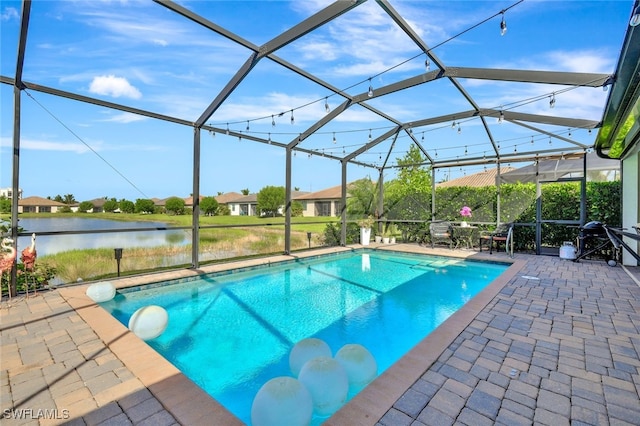 9207 Shadow Oak Ln, Naples, FL 34120 - swimming pool featuring a patio, a water view, and glass enclosure