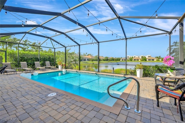 9207 Shadow Oak Ln, Naples, FL 34120 - swimming pool with a patio, a water view, and a lanai