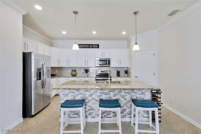 9207 Shadow Oak Ln, Naples, FL 34120 - kitchen with appliances with stainless steel finishes, tasteful backsplash, white cabinetry, a kitchen bar, and ornamental molding