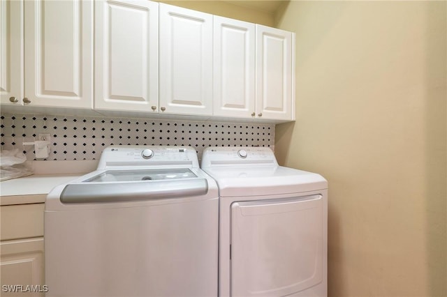 6325 Wilshire Pines Cir Unit 3, Naples, FL 34109 - washroom featuring cabinet space and separate washer and dryer