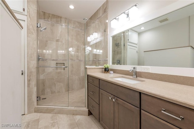 6325 Wilshire Pines Cir Unit 3, Naples, FL 34109 - bathroom with vanity, a shower stall, and recessed lighting