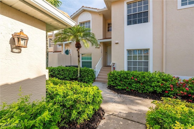 6325 Wilshire Pines Cir Unit 3, Naples, FL 34109 - entrance to property featuring stucco siding