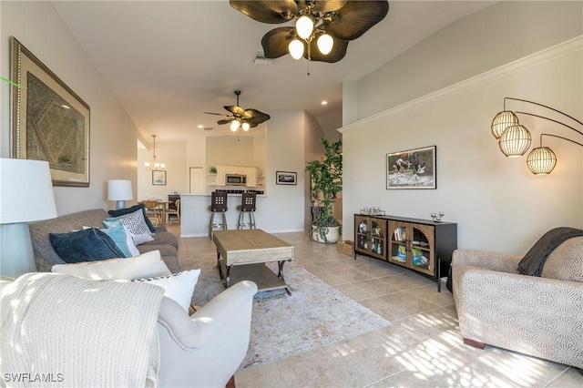 6325 Wilshire Pines Cir Unit 3, Naples, FL 34109 - living room featuring a ceiling fan, light tile patterned flooring, vaulted ceiling, a chandelier, and recessed lighting