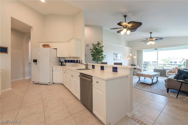 6325 Wilshire Pines Cir Unit 3, Naples, FL 34109 - kitchen with white fridge with ice dispenser, dishwasher, a peninsula, light tile patterned flooring, and vaulted ceiling