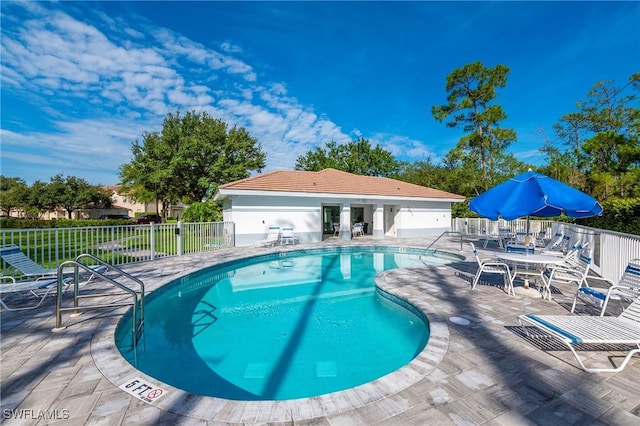 6325 Wilshire Pines Cir Unit 3, Naples, FL 34109 - community pool featuring a patio