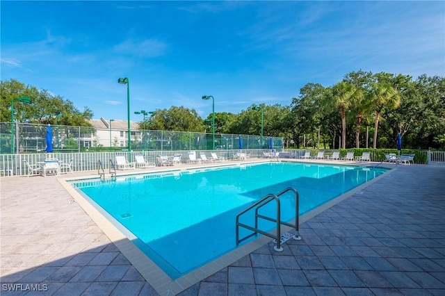 6325 Wilshire Pines Cir Unit 3, Naples, FL 34109 - community pool featuring a patio area