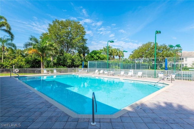 6325 Wilshire Pines Cir Unit 3, Naples, FL 34109 - community pool with a patio area