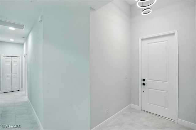 1002 E 17th St, Lehigh Acres, FL 33972 - hallway featuring baseboards