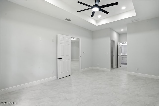 1002 E 17th St, Lehigh Acres, FL 33972 - empty room with ceiling fan, recessed lighting, and a raised ceiling
