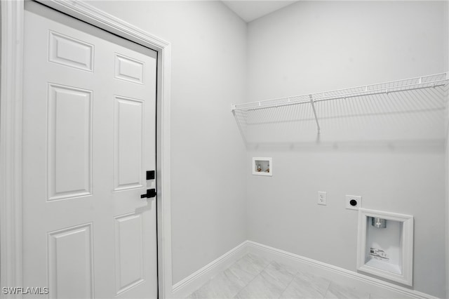 1002 E 17th St, Lehigh Acres, FL 33972 - laundry room with electric dryer hookup, washer hookup, and light marble finish flooring