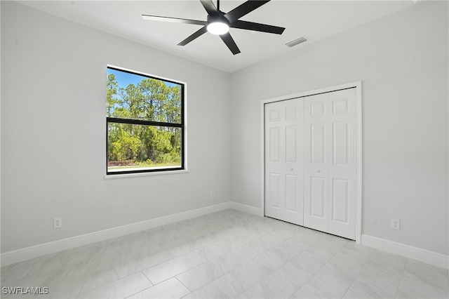 1002 E 17th St, Lehigh Acres, FL 33972 - unfurnished bedroom featuring a closet and ceiling fan