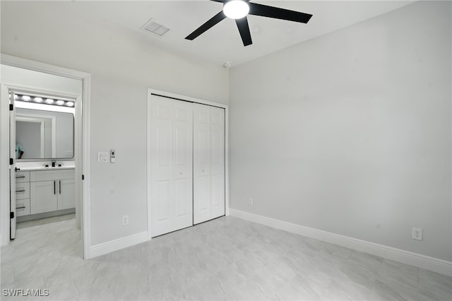 1002 E 17th St, Lehigh Acres, FL 33972 - unfurnished bedroom with a closet and a ceiling fan