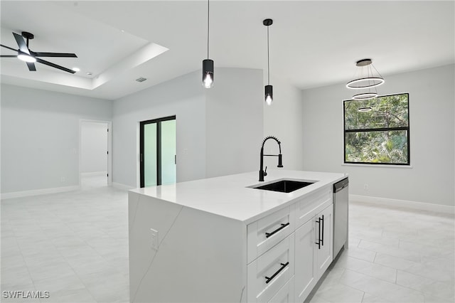 1002 E 17th St, Lehigh Acres, FL 33972 - kitchen featuring stainless steel dishwasher, decorative light fixtures, light countertops, ceiling fan, and open floor plan