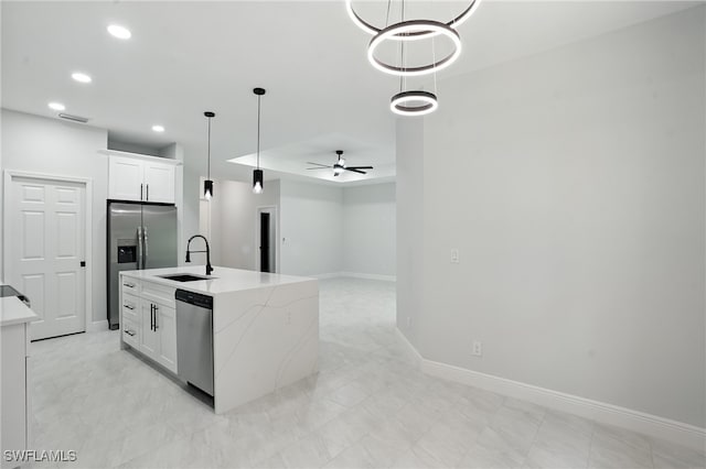 1002 E 17th St, Lehigh Acres, FL 33972 - kitchen with appliances with stainless steel finishes, ceiling fan, pendant lighting, white cabinetry, and recessed lighting