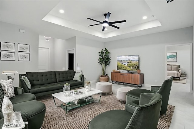 1002 E 17th St, Lehigh Acres, FL 33972 - tiled living room with a raised ceiling, a ceiling fan, and recessed lighting
