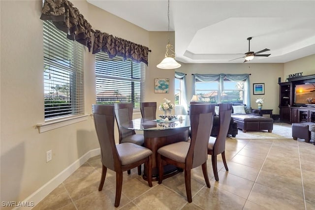 9693 Cobalt Cove Cir, Naples, FL 34120 - tiled dining area featuring healthy amount of natural light, a raised ceiling, and a ceiling fan