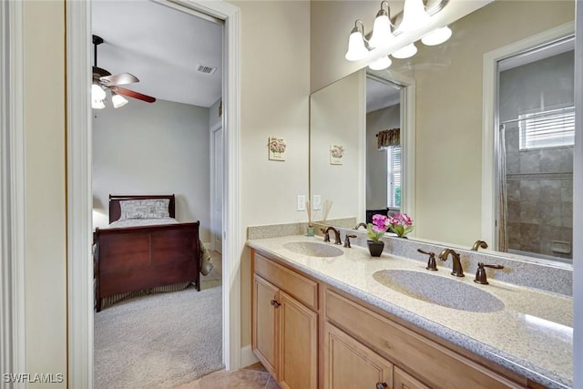 9693 Cobalt Cove Cir, Naples, FL 34120 - ensuite bathroom with double vanity, ceiling fan, and a shower with shower curtain