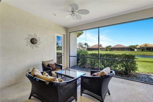 9693 Cobalt Cove Cir, Naples, FL 34120 - sunroom with a ceiling fan and a water view
