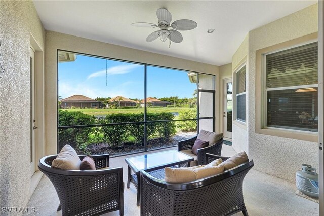 9693 Cobalt Cove Cir, Naples, FL 34120 - sunroom / solarium with ceiling fan and an outdoor living space