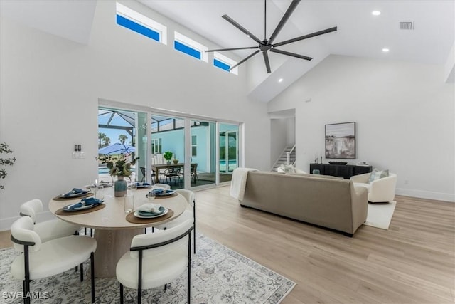 3548 Mondovi Ct, Punta Gorda, FL 33950 - dining room with a high ceiling, plenty of natural light, light wood-style floors, a ceiling fan, and recessed lighting