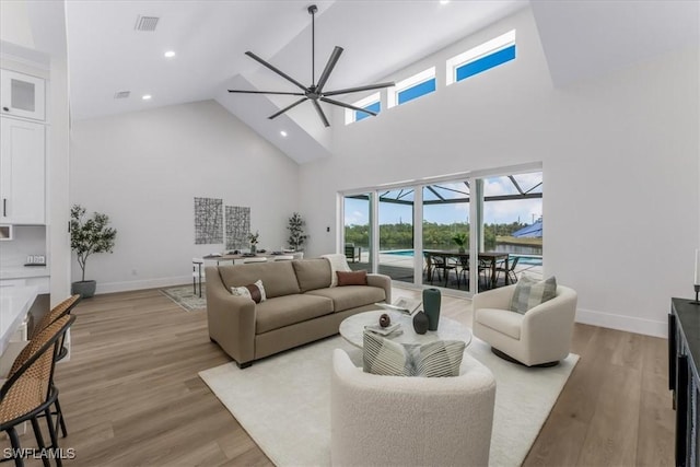 3548 Mondovi Ct, Punta Gorda, FL 33950 - living room featuring ceiling fan, high vaulted ceiling, light wood-type flooring, and recessed lighting