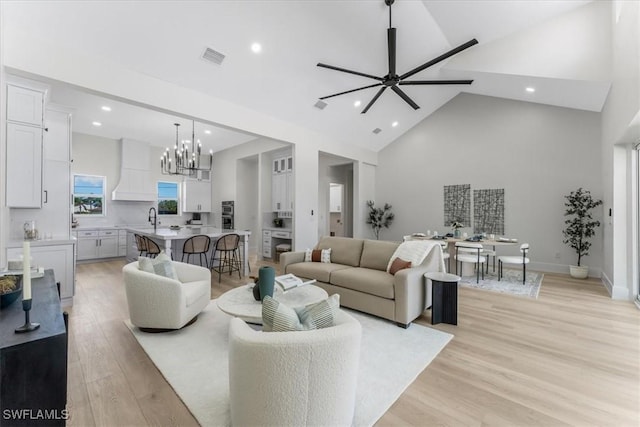 3548 Mondovi Ct, Punta Gorda, FL 33950 - living area with high vaulted ceiling, recessed lighting, a chandelier, light wood finished floors, and ceiling fan