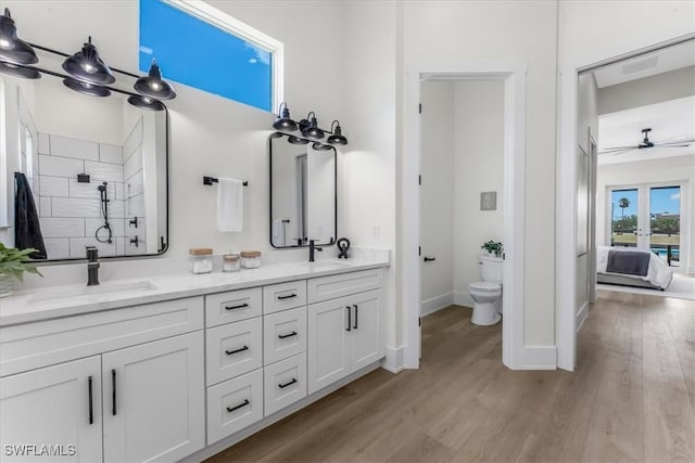 3548 Mondovi Ct, Punta Gorda, FL 33950 - ensuite bathroom with double vanity, wood finished floors, ceiling fan, and a tile shower