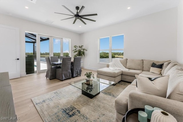 3548 Mondovi Ct, Punta Gorda, FL 33950 - living room featuring light wood-style floors, a ceiling fan, and recessed lighting